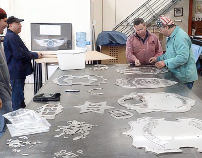looking over several LAPD Series Badges as they are laser cut.